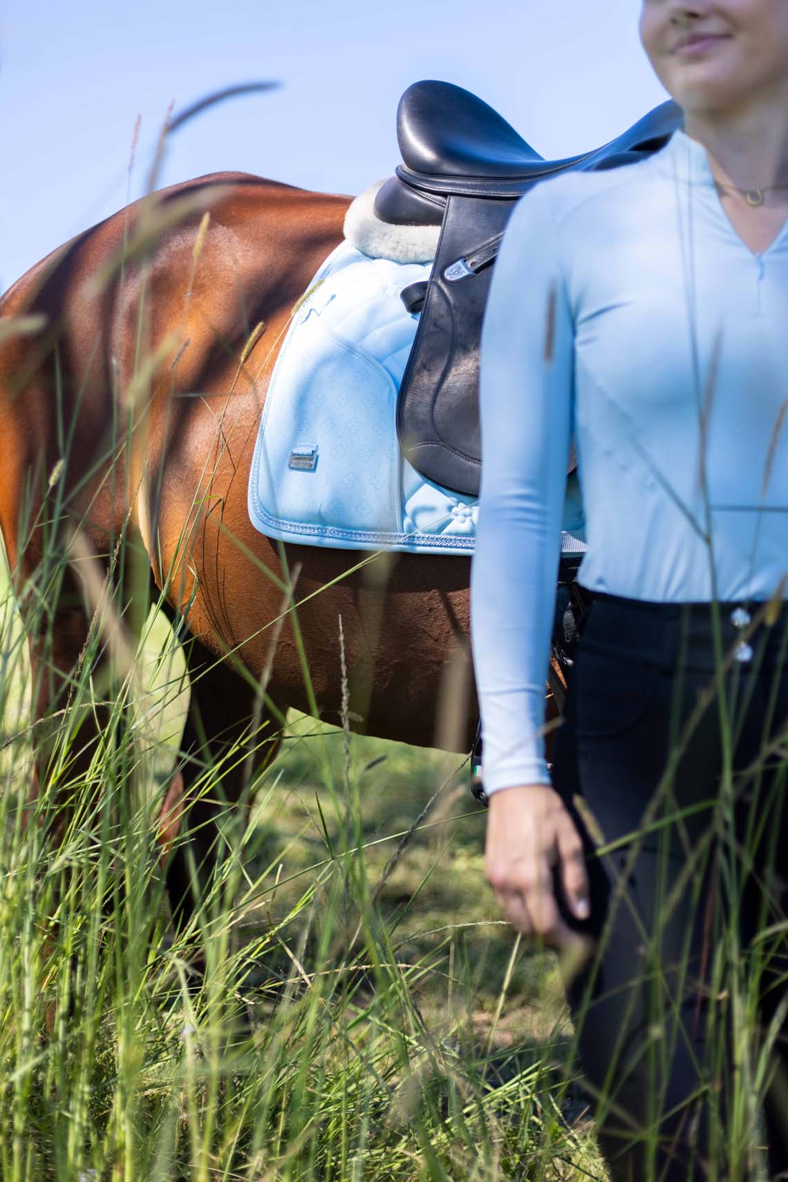 Baby blue horse saddle pad with modern phone storage solution