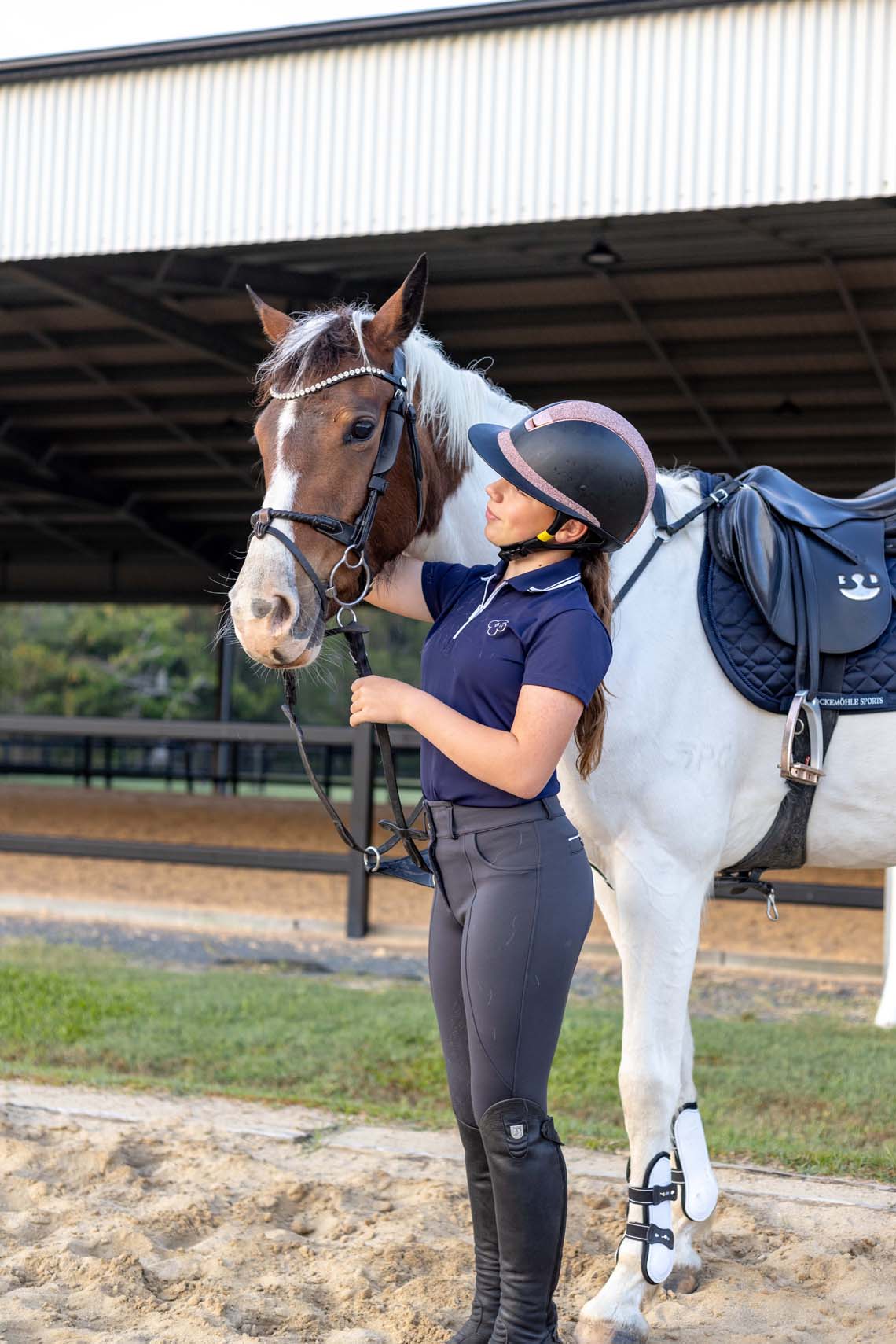 Competition-ready navy polo shirt for equestrian show riders