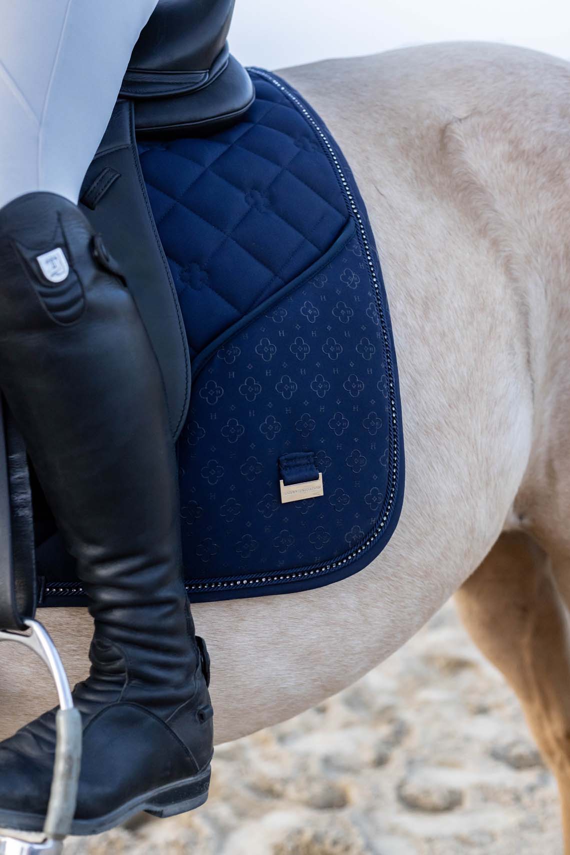 Dark navy horse saddle pad showing zippered phone pocket detail