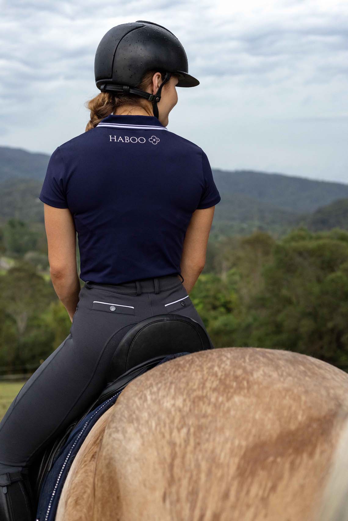 Navy riding polo with fade-resistant color and premium construction