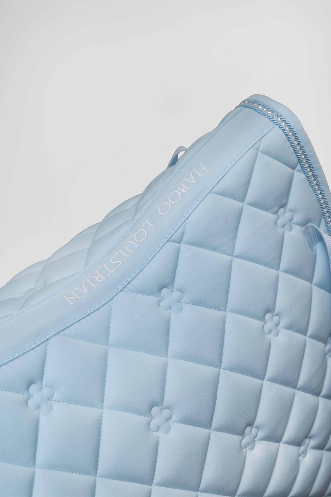 Baby blue riding saddle pad with concealed phone pocket technology