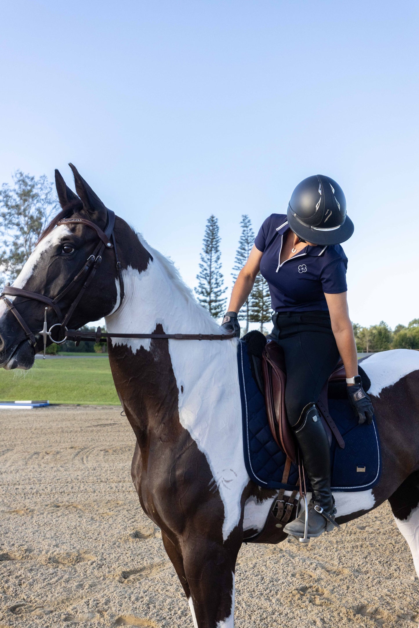 Dark navy horse saddle pad featuring secure phone storage compartment