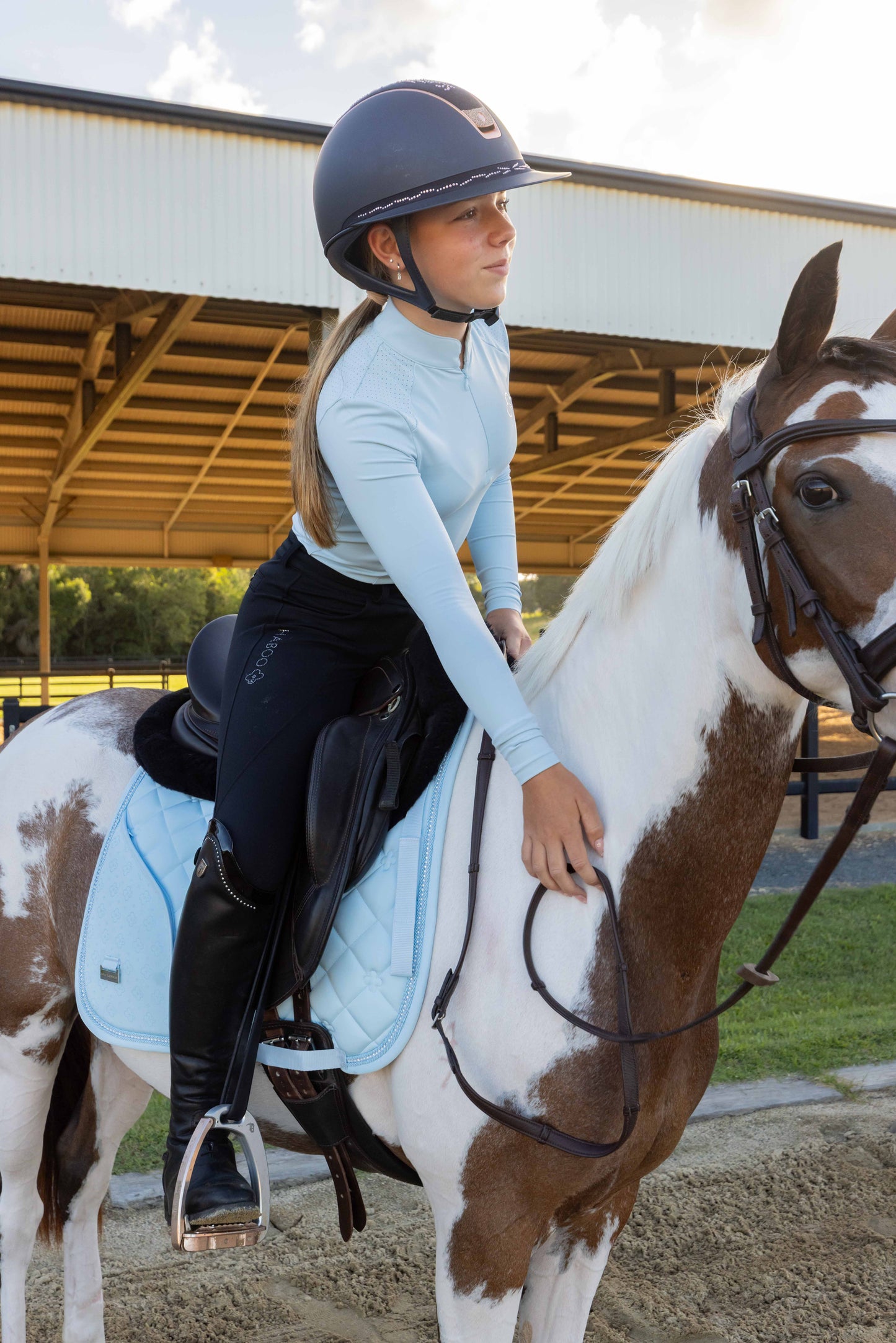 Baby blue saddle pad with hidden phone pocket for equestrian riders