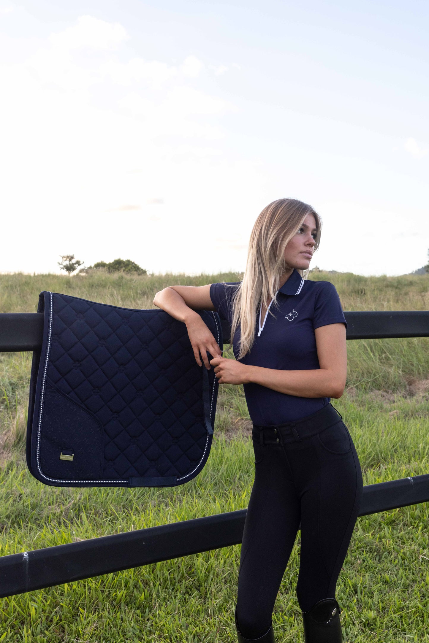 Navy blue riding saddle pad with concealed phone pocket for horse riders