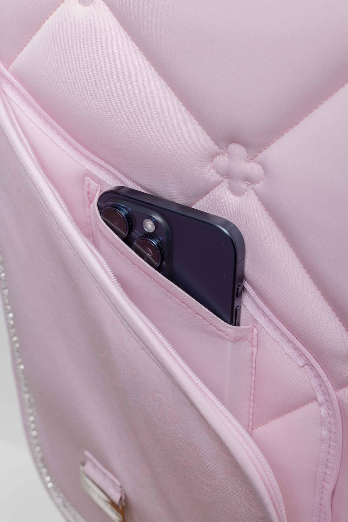 Hidden phone pocket zipper detail on pink equestrian saddle pad