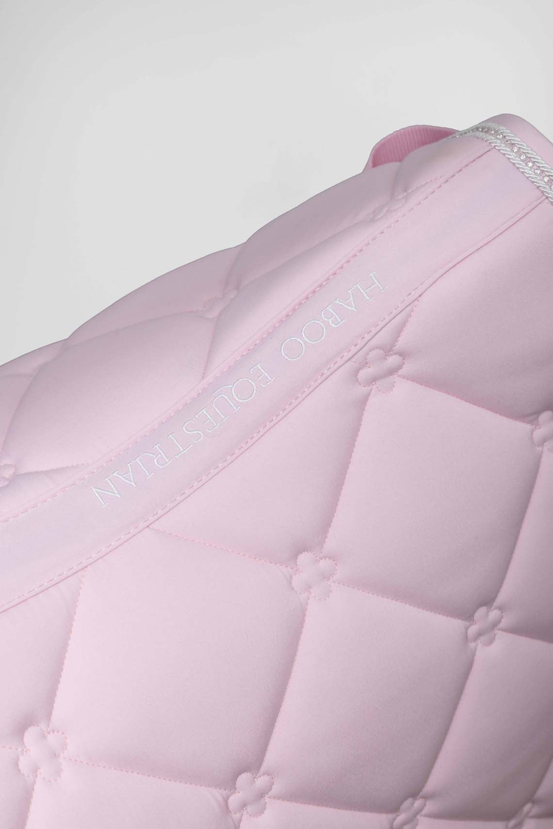 Baby pink saddle pad fabric detail showing quality construction