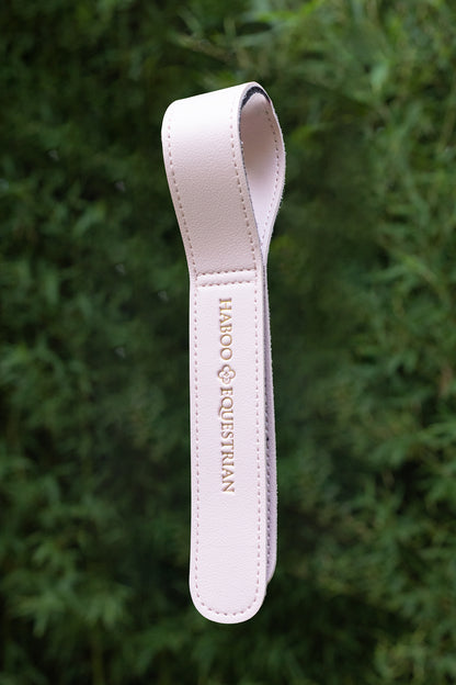 Pink Tack Mate stable organiser keeping equestrian equipment tidy